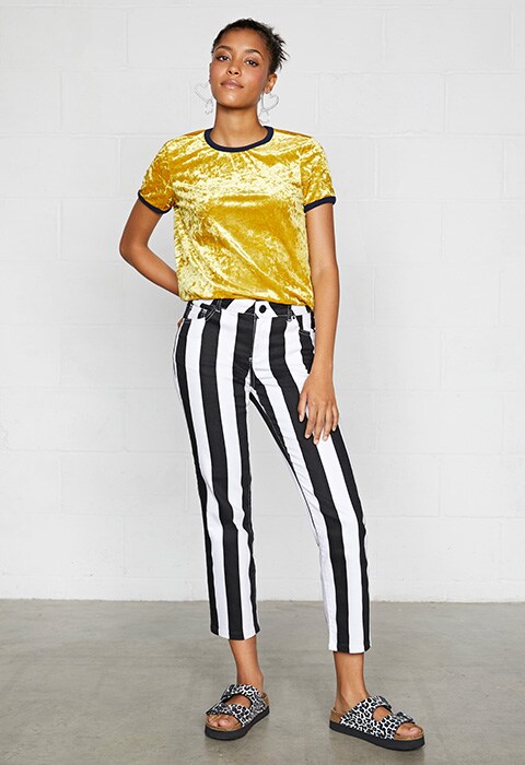 Model wearing striped trousers and velvet top | ASOS Fashion & Beauty Feed