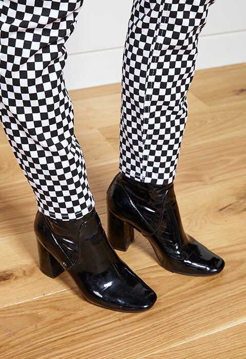 Nicole Privett wearing checkerboard trousers | ASOS Fashion & Beauty Feed