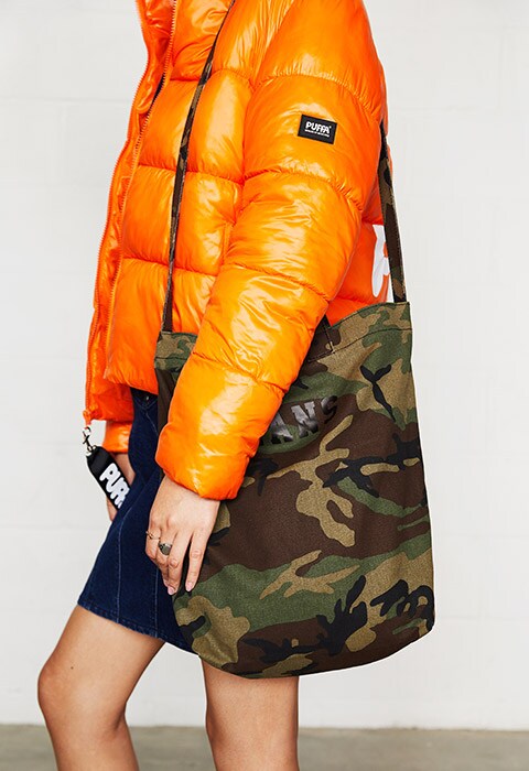 Model wearing a puffer jacket and denim dress | ASOS Fashion & Beauty Feed
