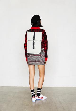 white backpack on girl