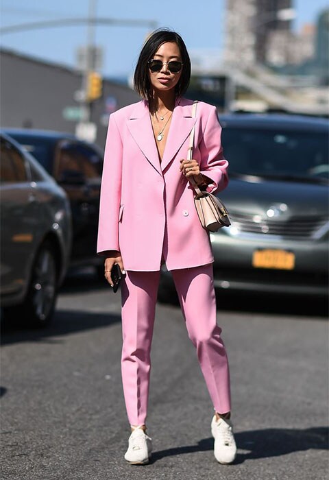 Street-styler wearing a pink two-piece suit at NYFW | ASOS Fashion & Beauty Feed