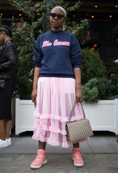 Street-styler wearing a pink tulle skirt with Nike sneakers at NYFW | ASOS Fashion & Beauty Feed