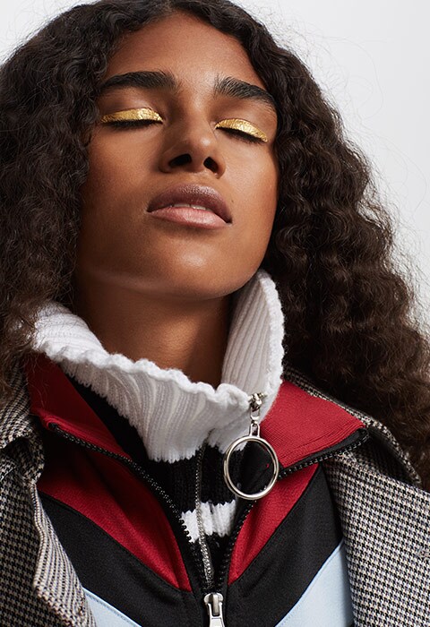 Model Laetitia wearing a check trench and trousers | ASOS Fashion & Beauty Feed