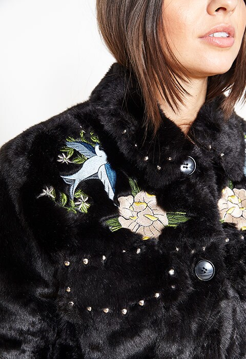 Laura Shehata wearing a western fur jacket