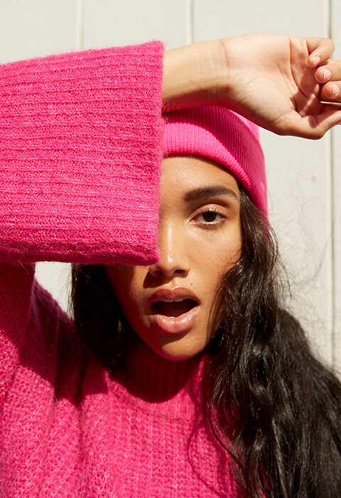 Model wearing a pink Monki beanie | ASOS Style Feed