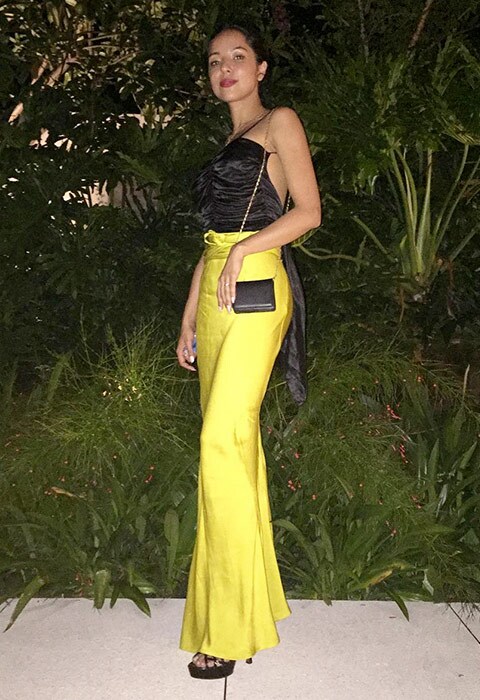 ASOS Insider Elizabeth wearing yellow satin trousers and black cami top | ASOS Fashion & Beauty Feed 