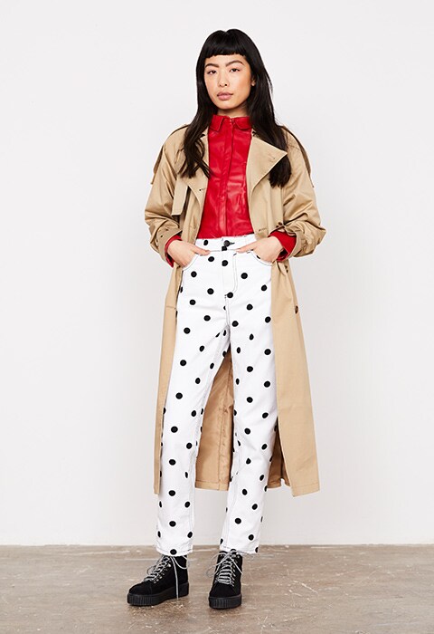 Model wearing a mac and polka dot mom jeans