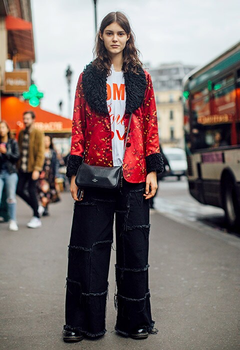 Street-styler wearing skater jeans and a statement jacket