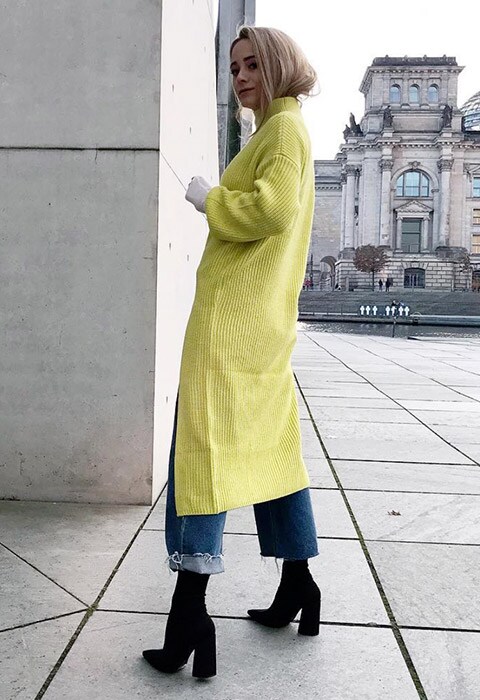 ASOS Insider Jana wearing a knit dress and jeans