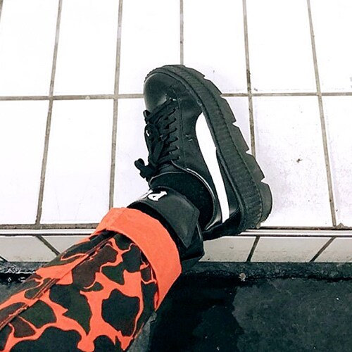 ASOS Insider Barbara wearing camouflage trousers and Fenty x Puma trainers