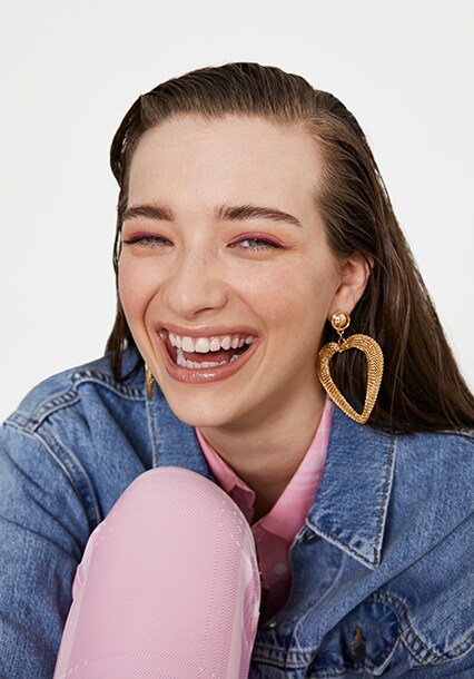 Model wearing sporty pastels and a denim jacket, available at ASOS