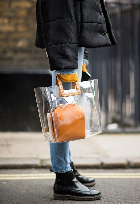 Model wearing a plastic bag at London Fashion Week
