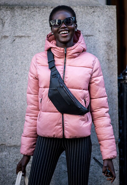Model wearing a pink puffer jacket at London Fashion Week