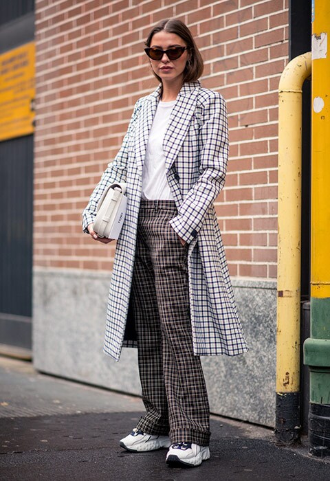 Street style star wearing checks at Milan Fashion Week AW18