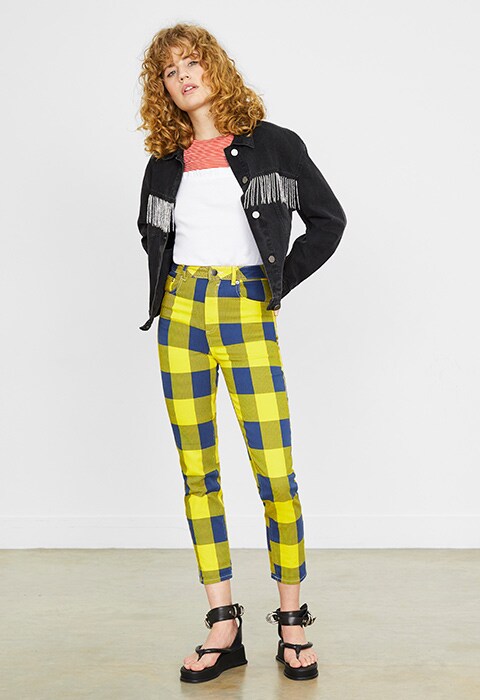 Model wearing check denim trousers available at ASOS