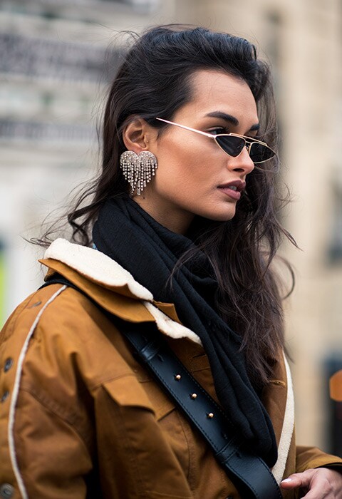 Model wearing sparkly earrings at paris fashion week