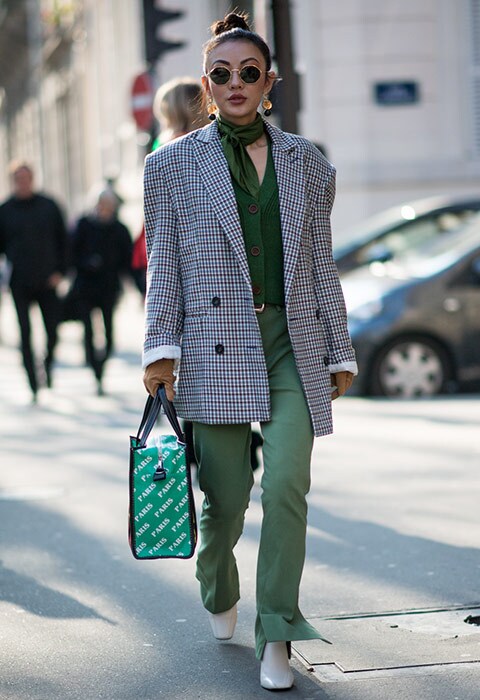 Street style blogger wearing a check blazer at Paris Fashion Week