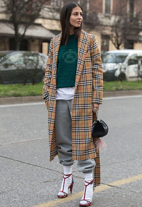 Socks, sandals, tracksuit and Burberry trench coat at fashion week street style