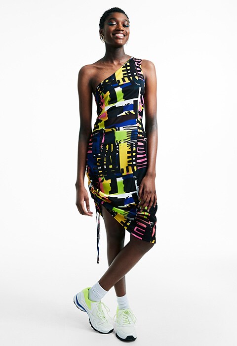 Model wearing MADE IN KENYA SS18 asymmetric dress