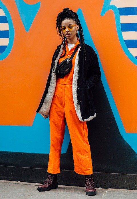 London street-styler wearing an orange boilersuit