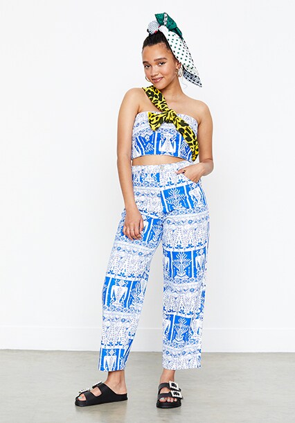 Model wearing a printed denim bandeau co-ord, available at ASOS