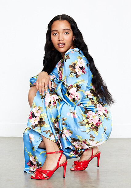 Model wearing silk floral dress, available at ASOS