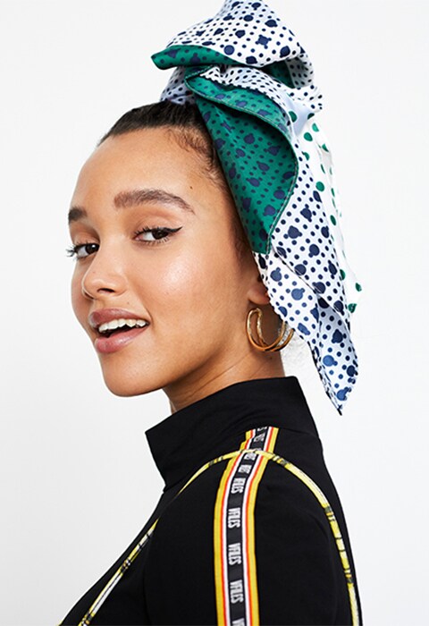 Model wearing a printed denim bandeau co-ord, available at ASOS