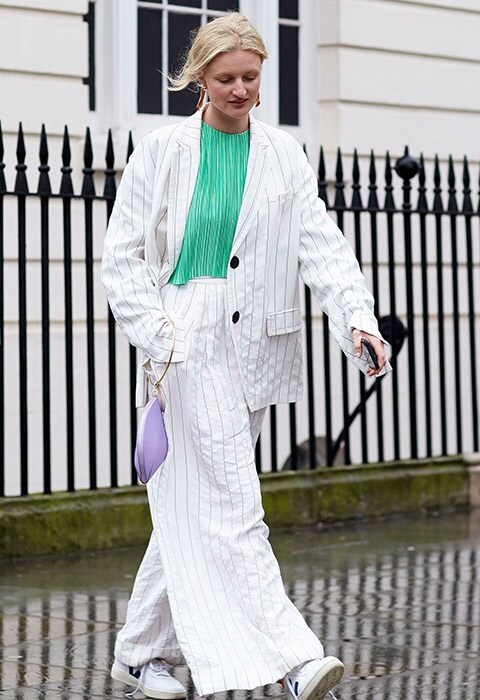 Street style blogger wearing a white pinstripe suit, perfect for bank holiday style inspiration