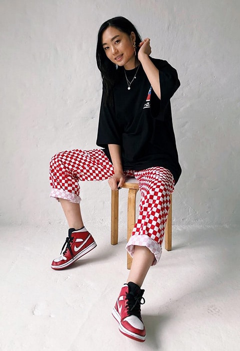 ASOS Insider Kicki wearing checkboard motocross printed jeans for spring