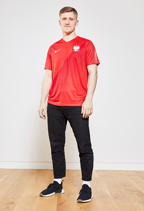 Sebastian Clarke wearing a football shirt, available at ASOS