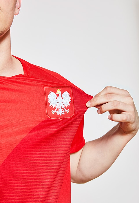 Sebastian Clarke wearing a Nike World Cup football shirt, available at ASOS