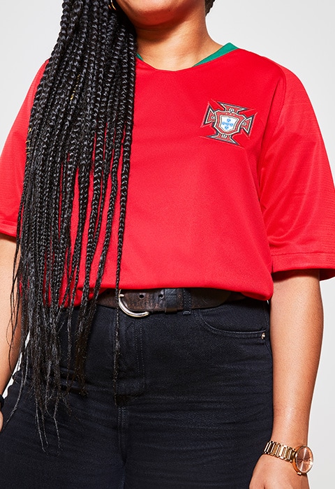 Stephanie wearing a football shirt, available at ASOS