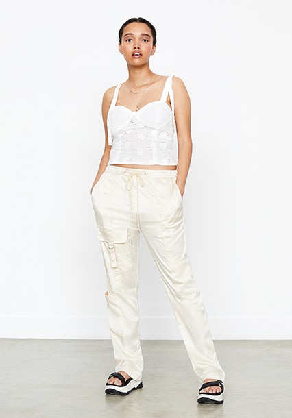Model wearing corset top and cargo trousers, available at ASOS