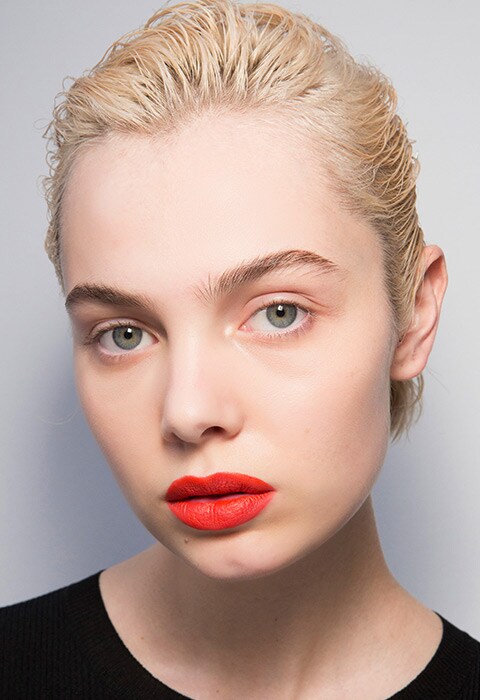 Model at MGSM SS18 wearing orange lipstick