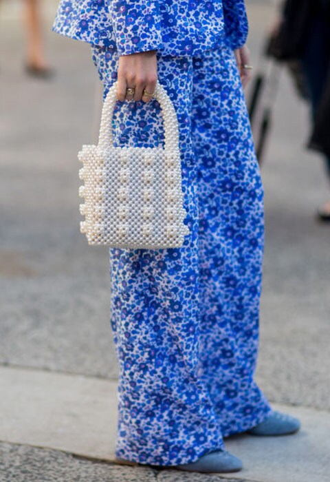 Street style blogger wearing a pearl bag