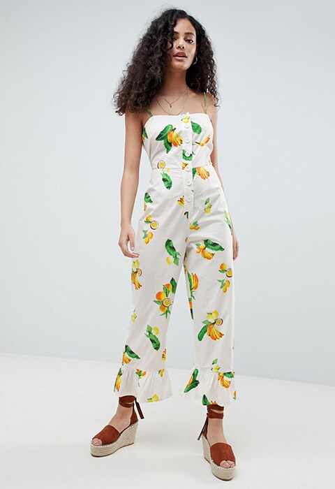 ASOS DESIGN cotton frill hem jumpsuit with square neck and button detail in fruit print, available at ASOS