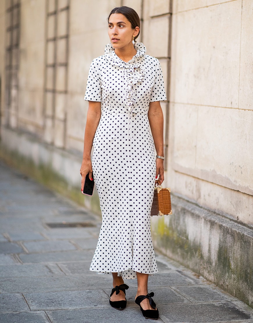 A street styler wears a white tea dress during the Paris couture shows White tea dress at the Christopher Kane SS18 runway show | ASOS Fashion & Beauty Feed