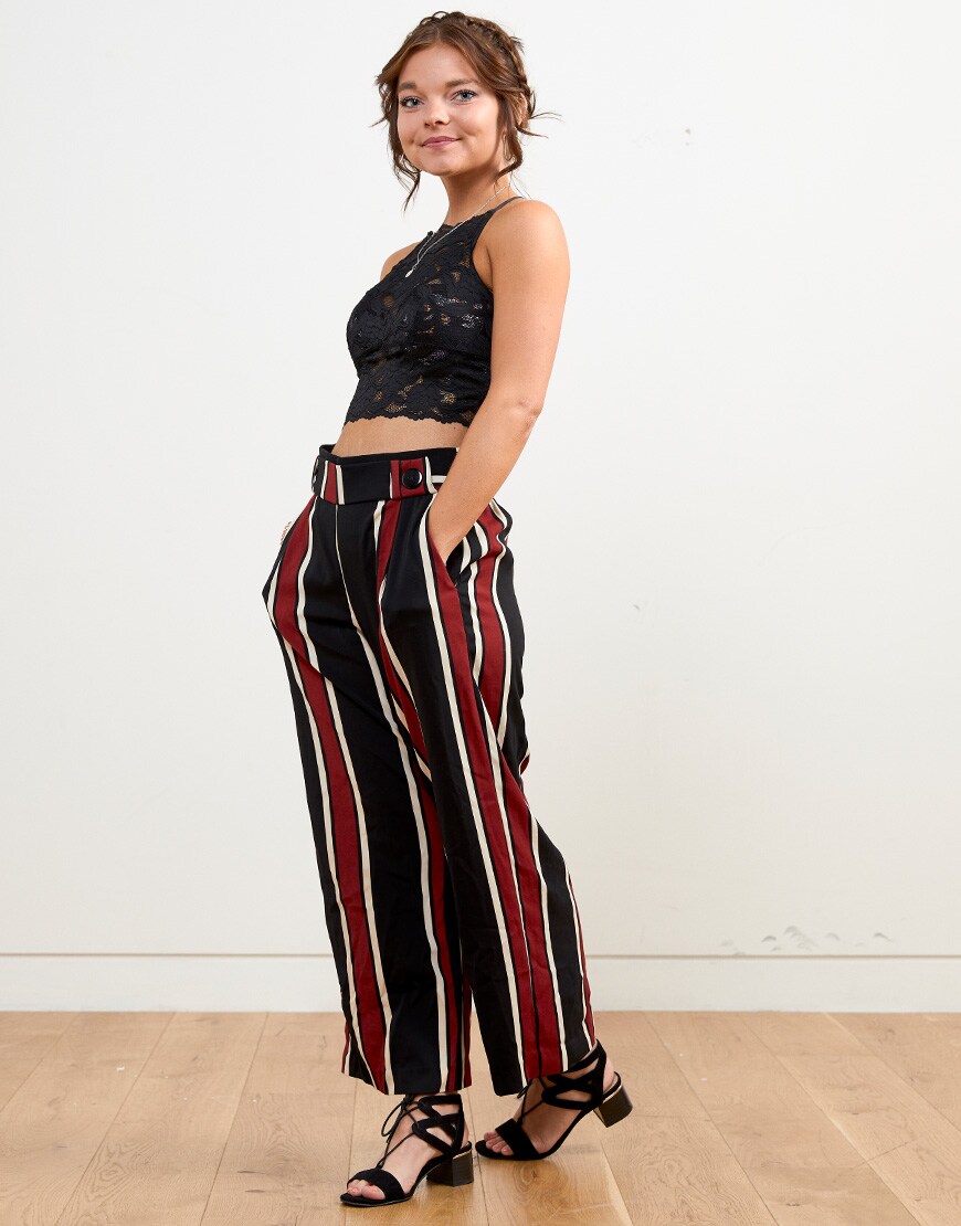 ASOS staff member wears trousers and lace bralet | ASOS Fashion & Beauty Feed