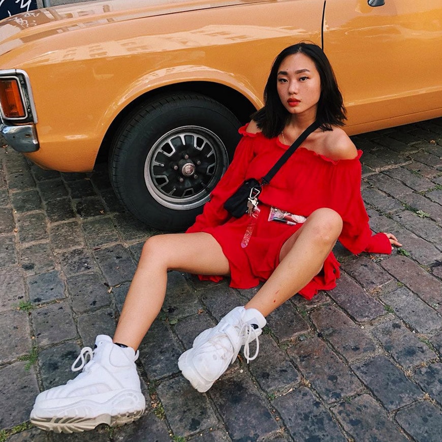 ASOS Insider Kicki in red cold shoulder dress and white Buffalo trainers