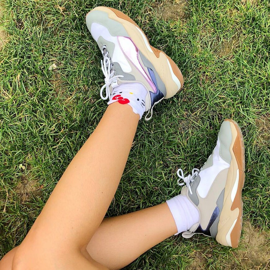 ASOS Barbara wearing Fila chunky trainers with Hello Kitty socks