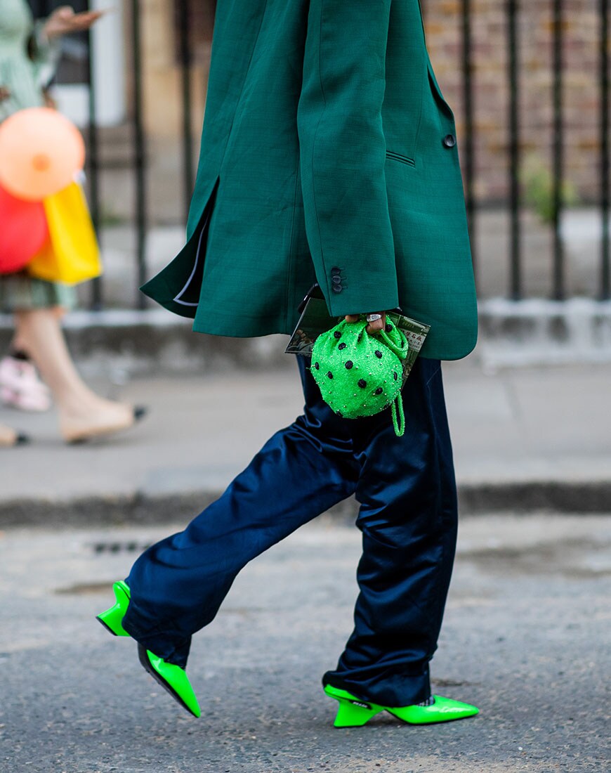 Street styler wearing neon accessories at London Fashion Week | ASOS Style Feed