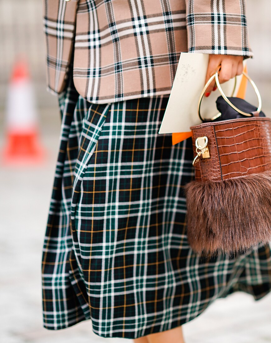 Street styler wearing double tartan at London Fashion Week | ASOS Style Feed