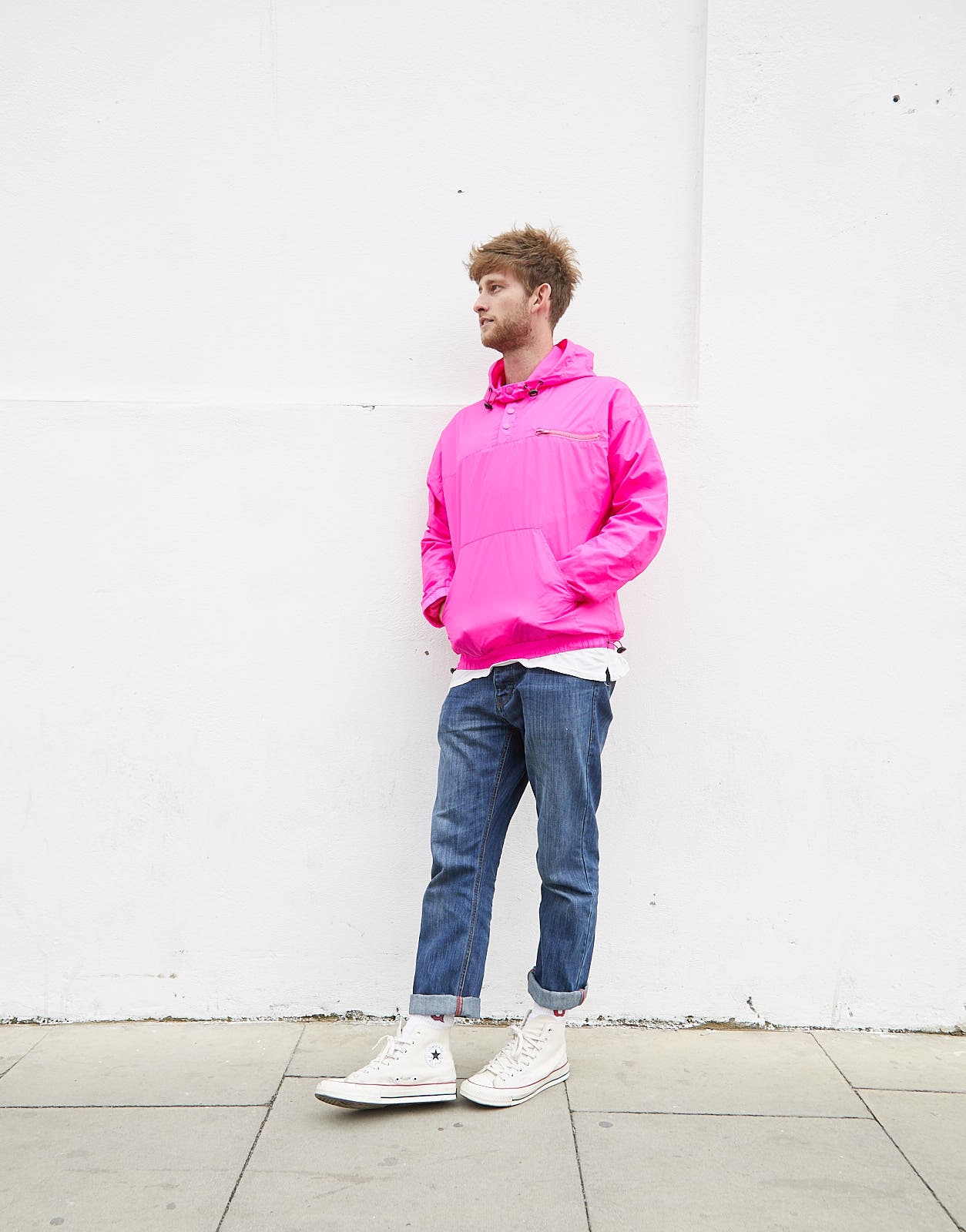 ASOS artworker Tom in a neon pink jacket
