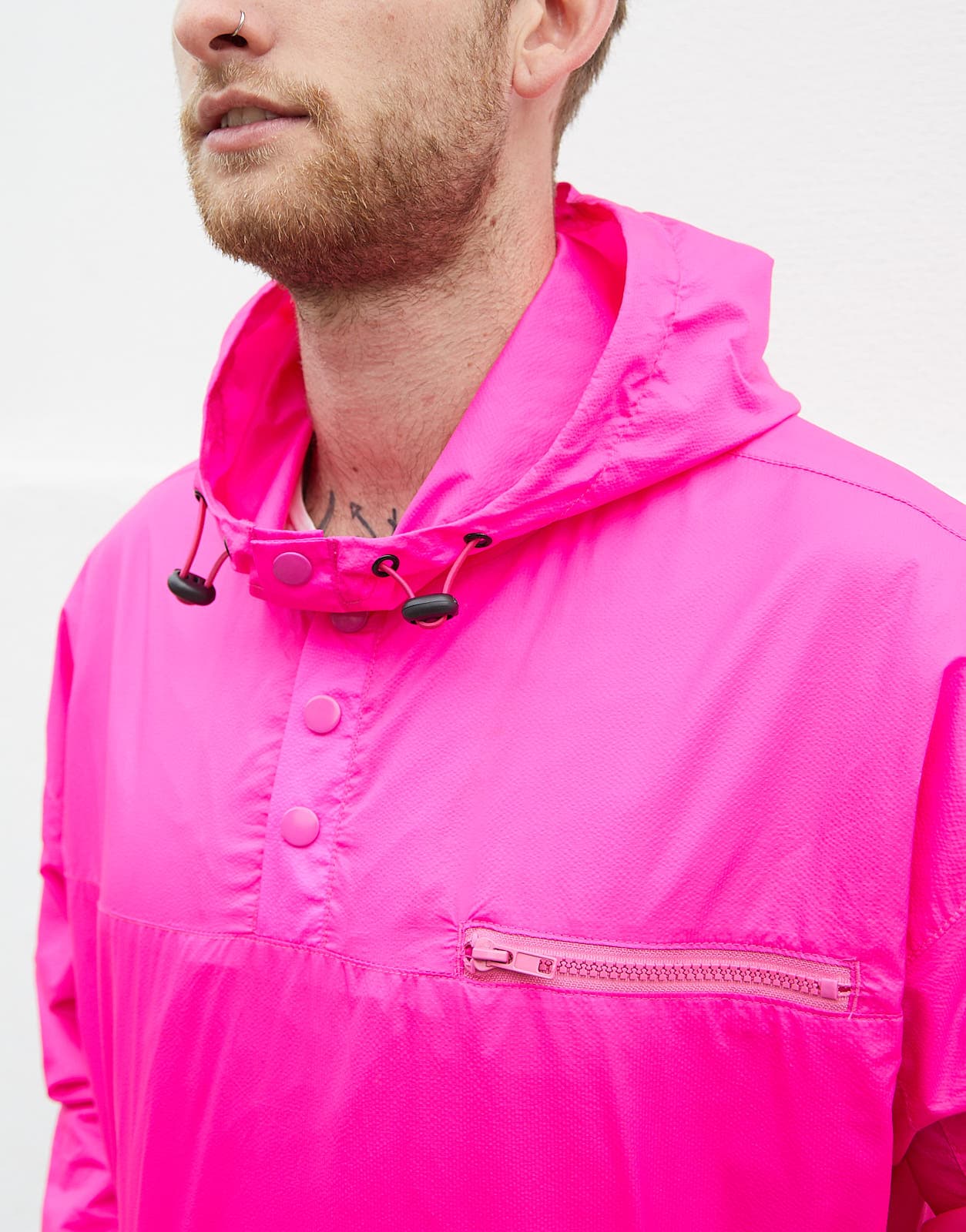 ASOS's Tom wears a neon pink jacket