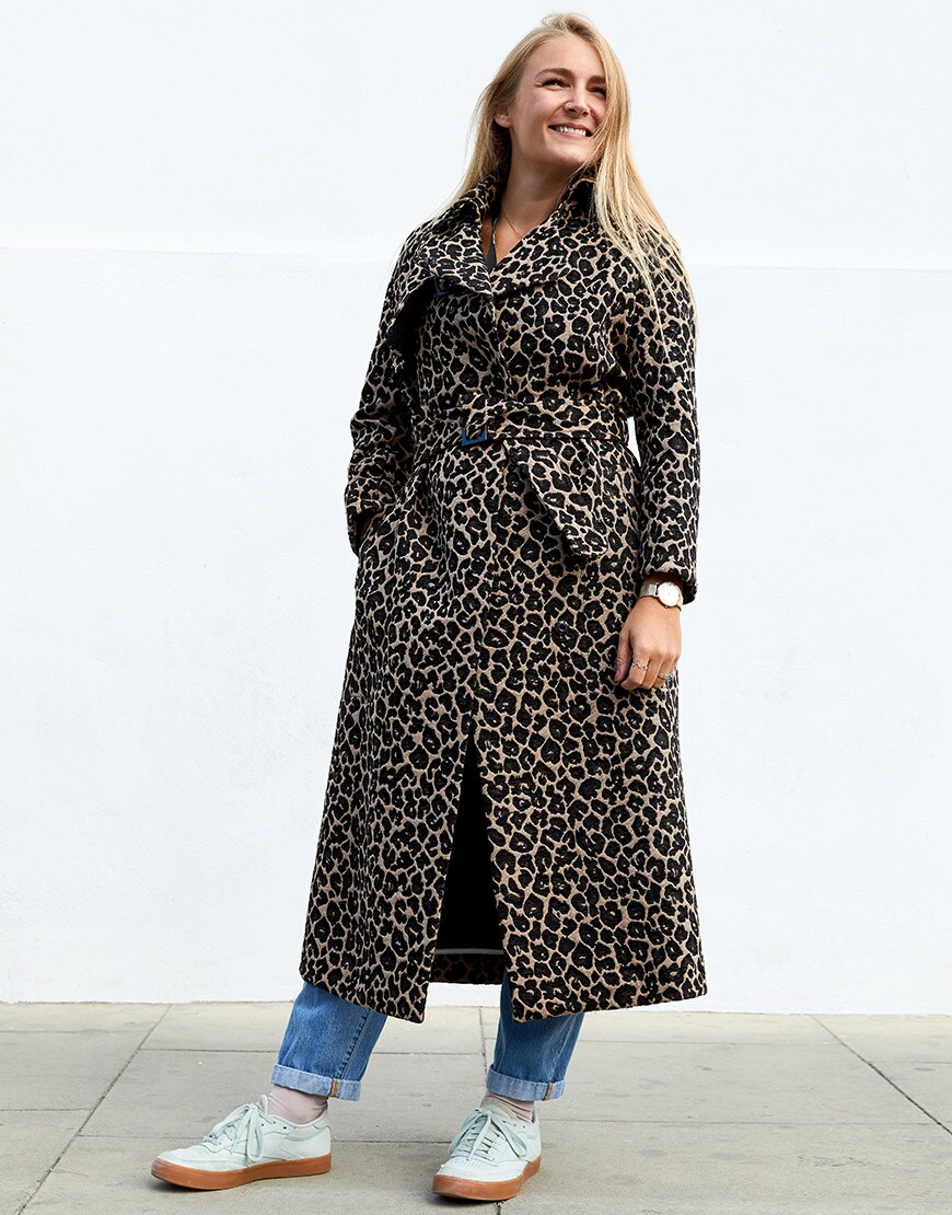  ASOSer wearing a leopard-print trench coat with blue jeans and pastel sneakers | ASOS Style Feed