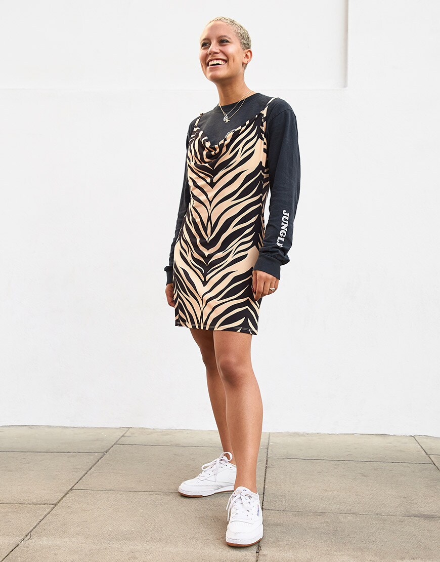 ASOSer wearing a long-sleeved T-shirt, tiger print dress and white trainers | ASOS Style Feed