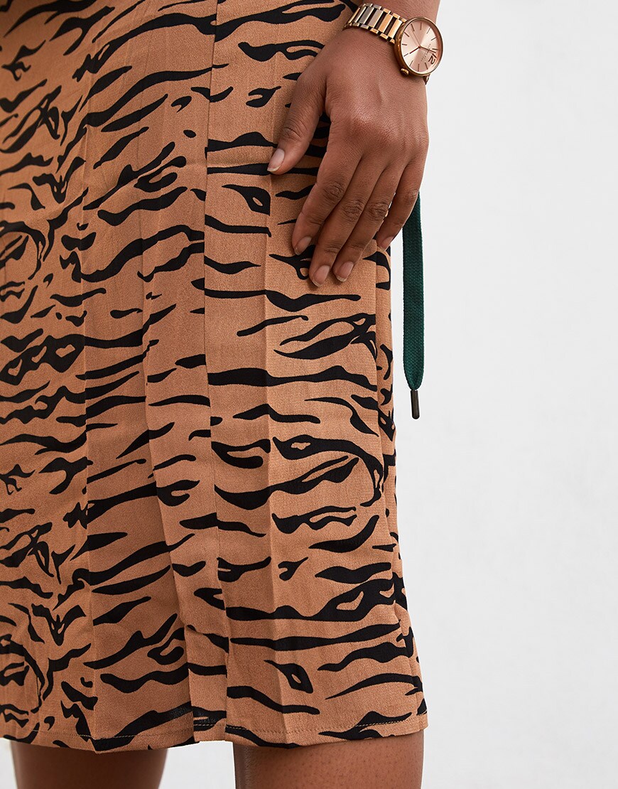 ASOSer wearing a sweatshirt, tiger print skirt and chunky trainers | ASOS Style Feed