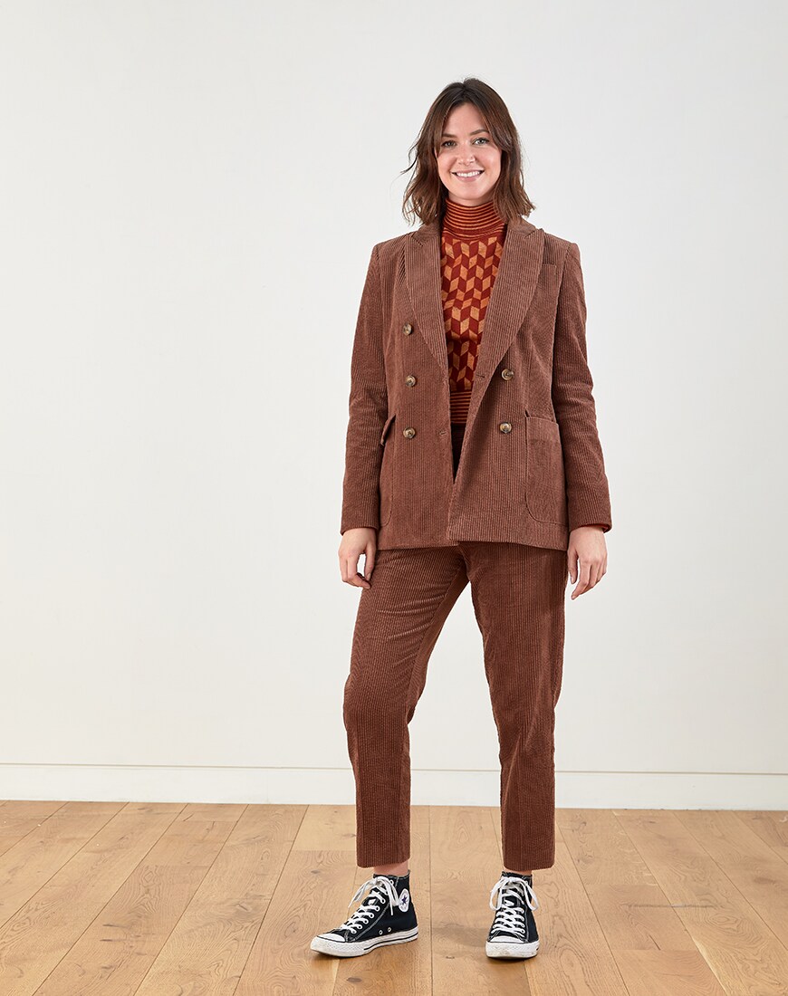 A brown cord suit with roll-neck