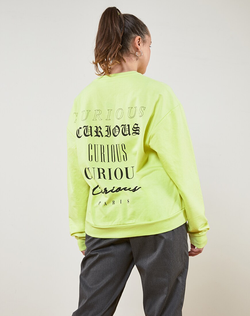 ASOS DESIGN sweatshirt in washed neon with slogan print