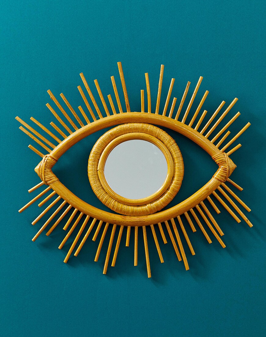 A picture of a mirror in the shape of an abstract eye by ASOS DESIGN. Available at ASOS.
